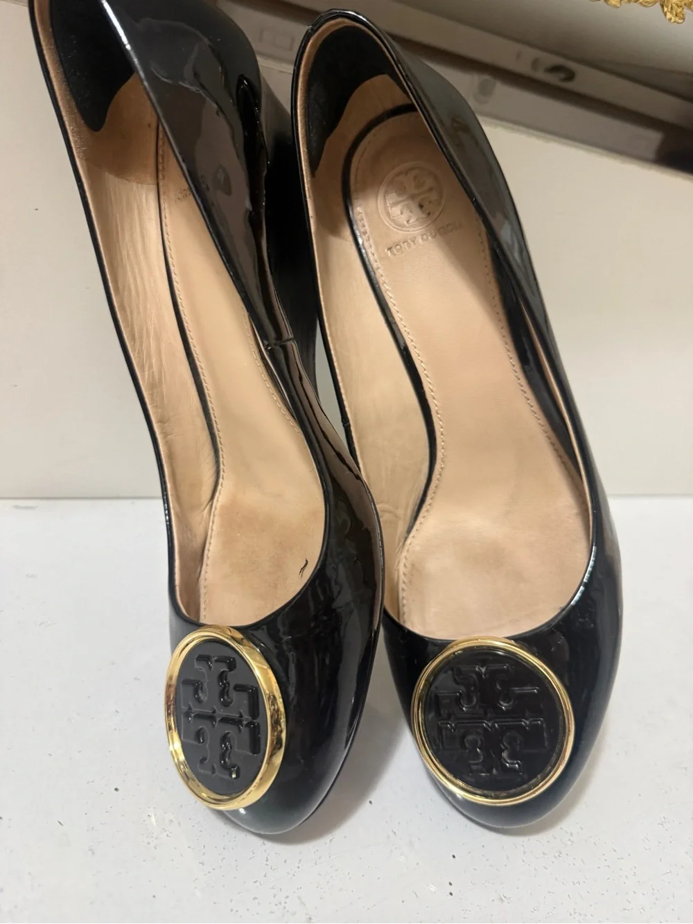 Tory Burch Black Patent Leather Wedge Flats with Gold Logo Medallions